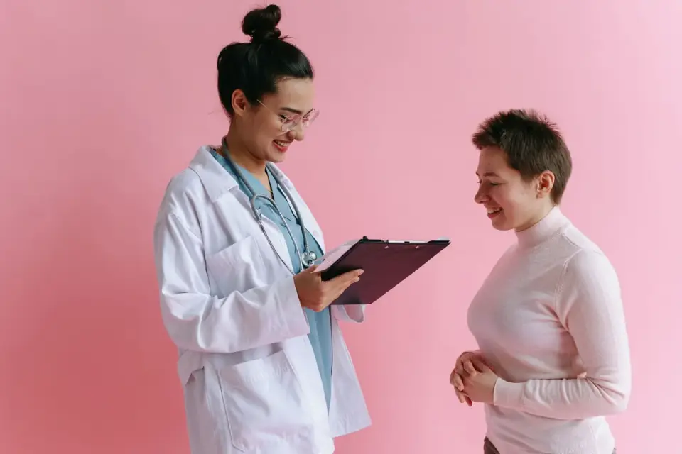 A veterinarian and dog owner reviewing a feeding plan together