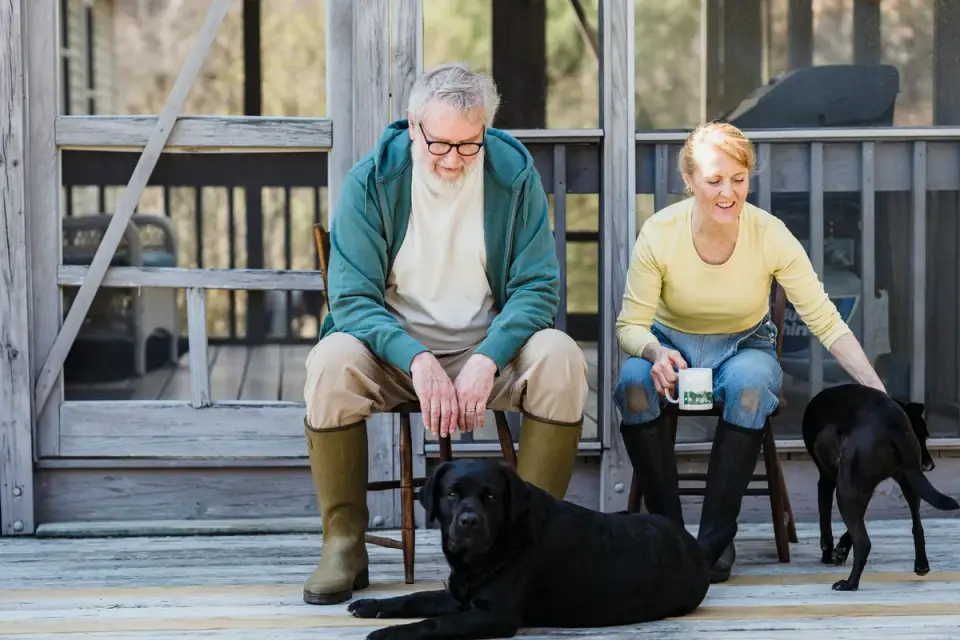 A veterinarian and dog owner reviewing a supplement label together at a clinic counter