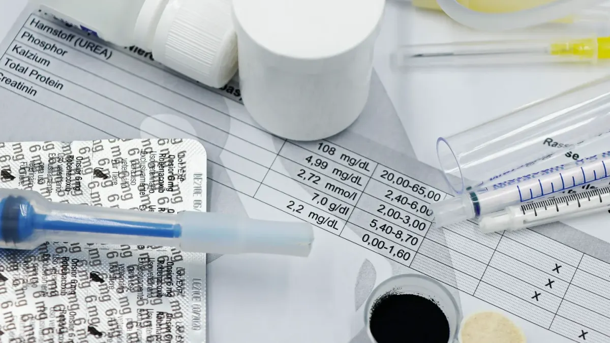A veterinarian reads a supplement label while a dog waits on the exam table