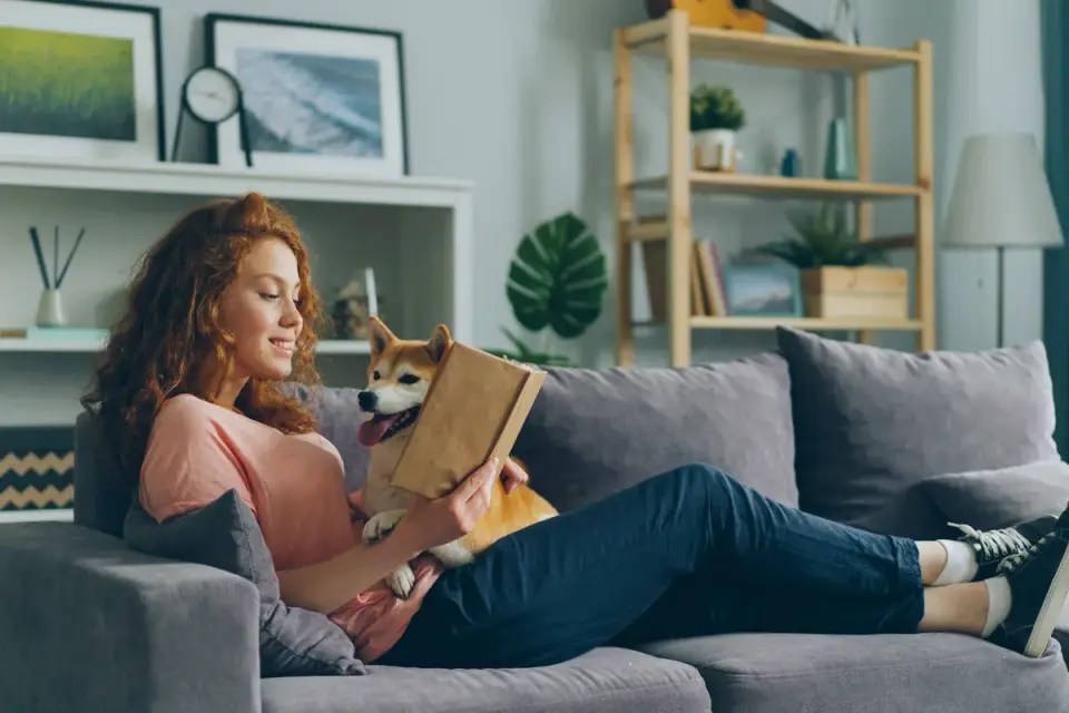 A veterinarian reviewing a supplement ingredient label with a dog owner