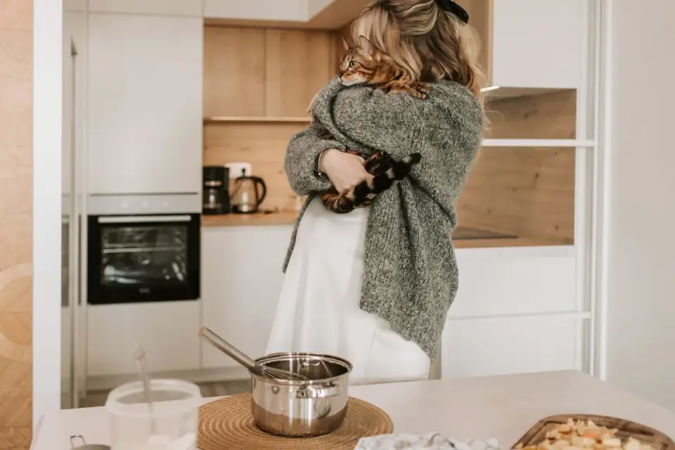 Dog owner preparing a meal