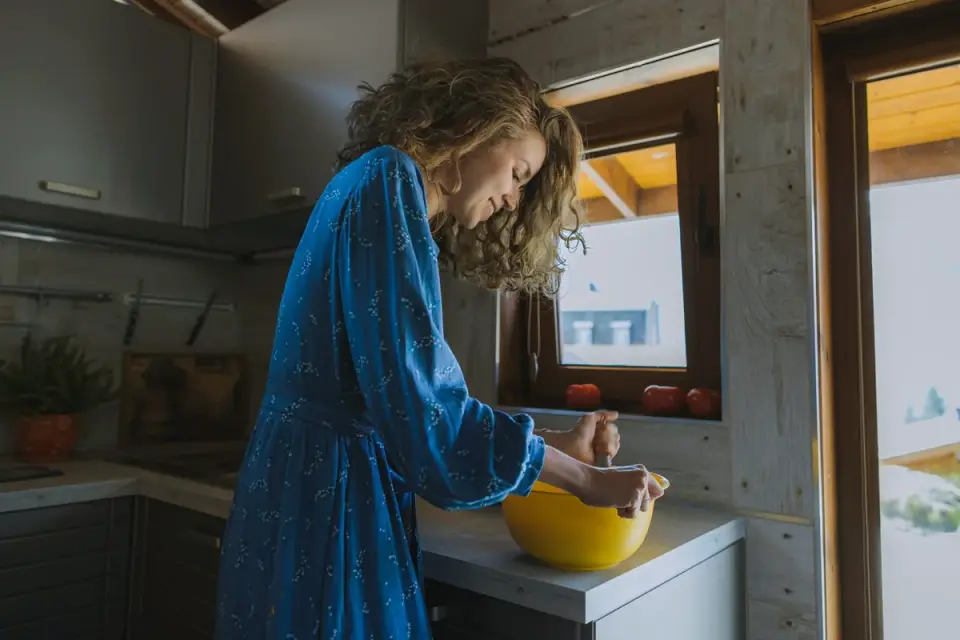 Dog owner preparing a meal