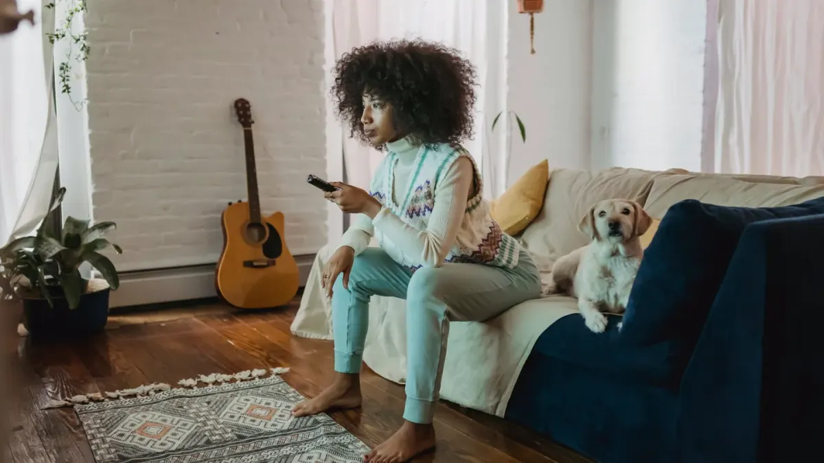 Dog resting beside an owner