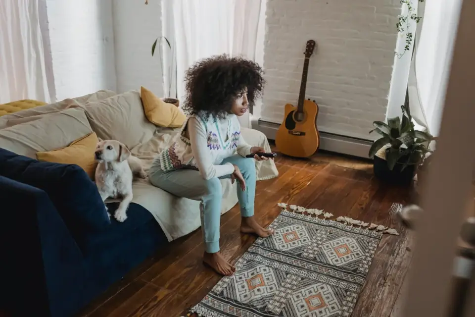 Dog resting beside an owner