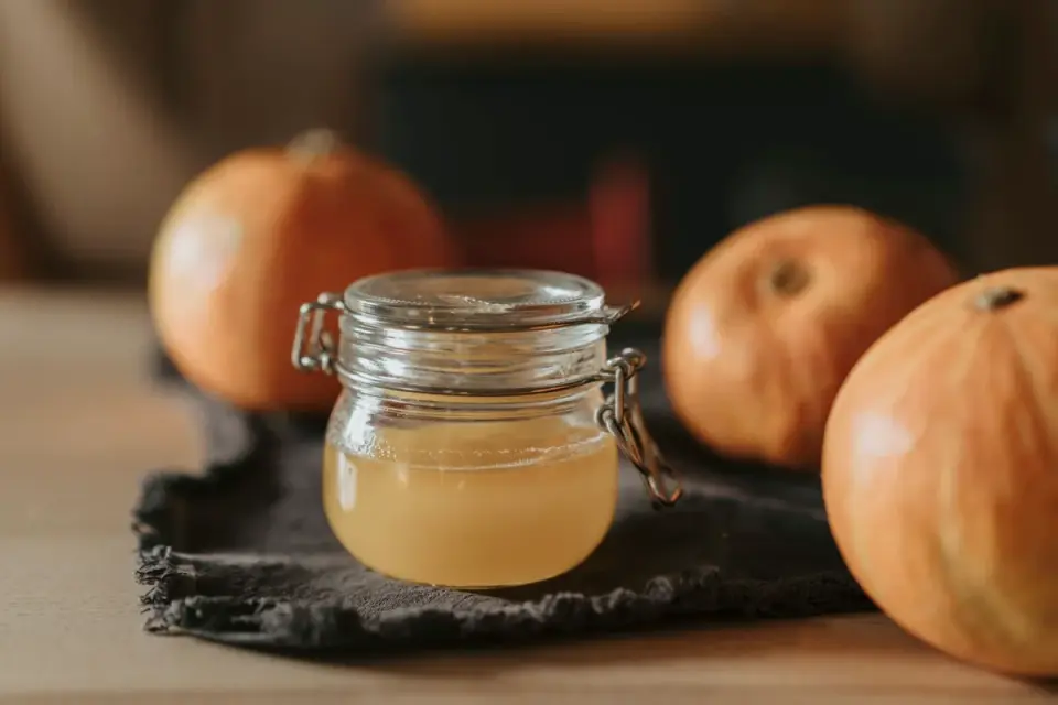 Pumpkin pieces and soft chew supplements arranged on a wooden table