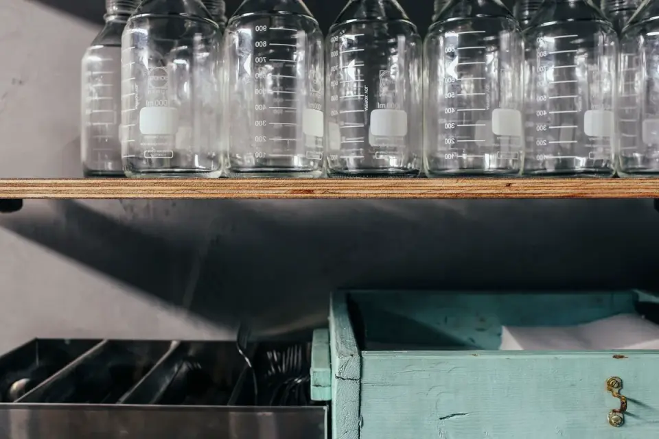 Several dog supplement bottles lined up on a shelf